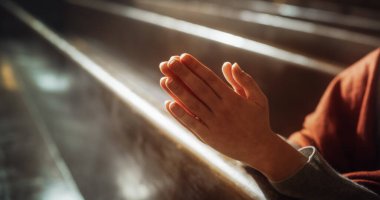 Close Up of Female Hands in Prayer Position in Church, Expressing Humility and Faith in God, Seeking Guidance and Strength. Following the Teaching of clipart