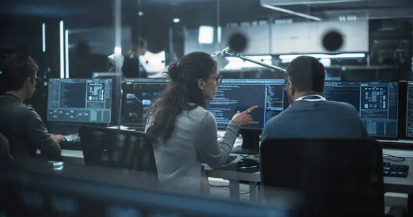 stock image Diverse Young Colleagues Working on Computers in a Research Laboratory. Female Asking Advice from a Male Software Developer Colleague About a Solution