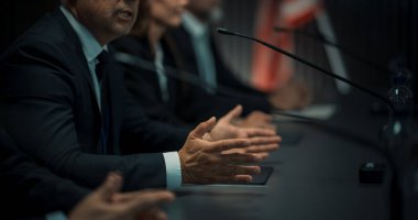 Close Up On Hands of Caucasian Male Organization Representative Speaking at Economic Conference. Head Of USA Delegation Delivering Speech at clipart