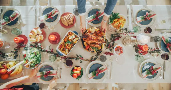 Stock image Top Down View Establishing Shot with Elegant Christmas Table with a Roast Turkey, Carefully Arranged Garnishes, Baked Potatoes, Variety of Vegetables