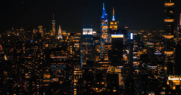 Aerial View of Midtown Manhattan Architecture at Night. Evening Shot of Financial Business District from a Helicopter. Scenery of Historic Office