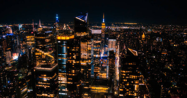 Aerial Helicopter View of Downtown Manhattan Architecture. Drone Photo of Skyscrapers and Office Buildings at Night. Evening Urban Landscape with