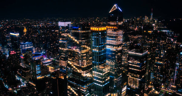 Aerial View of Midtown Manhattan Architecture at Night. Evening Shot of Financial Business District from a Helicopter. Scenery of Historic Office