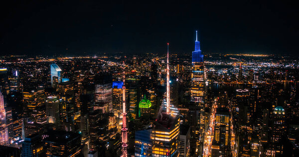 Aerial Photo of Office Buildings Late in the Evening. Rooms Have Lights On, Businesspeople and Managers Working Long Hours in New York City
