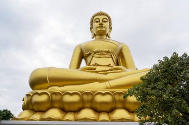 Giant seated Buddha at Wat Paknam in Bangkok, Thailand