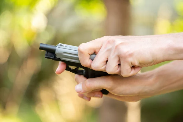 Anonymous Man Cocking Toy Gun Reloading Small Handgun Hands Closeup — Stock Photo, Image