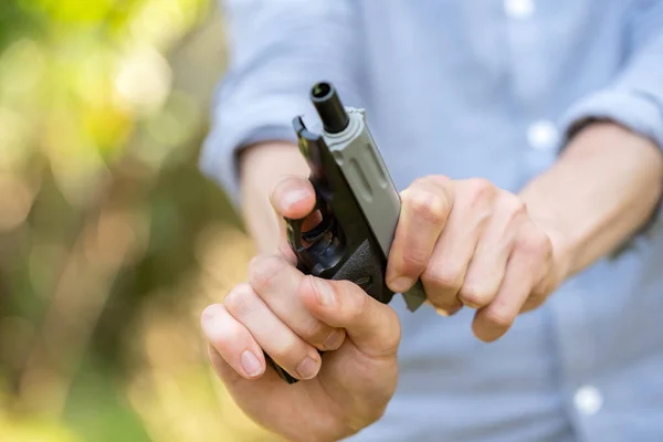 Anonymous Unrecognizable Man Reloading Cocking Small Plastic Toy Gun Fake — Stock Photo, Image