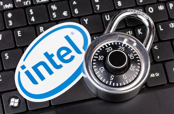 stock image Intel processors hardware safety and security patches, kernel level exploits, hacks, vulnerabilities and data leaks abstract concept. Intel logo, padlock, computer keyboard