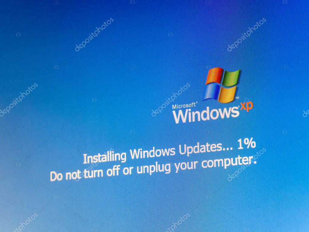 Microsoft Windows XP operating system update, installing updates one percent progress, do not turn off or unplug your computer OS update message simple concept, nobody