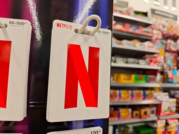 stock image Netflix brand logo gift cards sold in a convenience store, streaming subscription service coupon codes sold on voucher cards concept, object detail, nobody shop interior