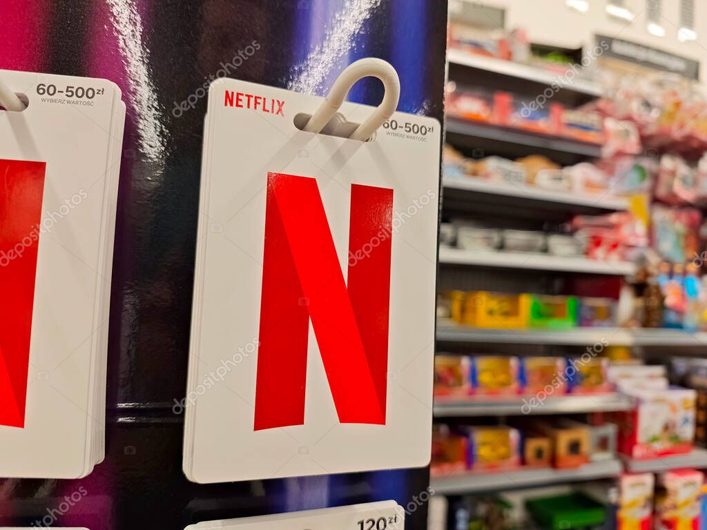 Netflix brand logo gift cards sold in a convenience store, streaming subscription service coupon codes sold on voucher cards concept, object detail, nobody shop interior