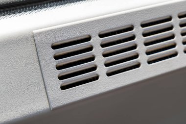 Simple clean metal air vent, air conditioning outlet holes, public transport vehicle train bus metro or industrial air duct part detail closeup, nobody. Cleaning, servicing AC systems simple concept clipart