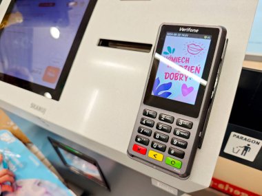 Modern wireless card payment terminal POS at self-checkout station in store, contactless payment technology close-up, touchscreen and keypad device retail point of sale clipart