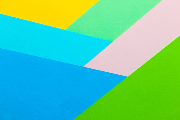 Multicolored geometric background from paper cardboard abstraction.