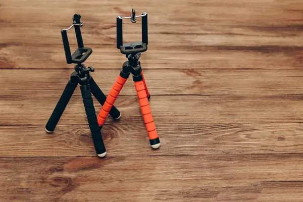Two Manual Tripod Monopods Phone Small Camera Wooden Table — Stock fotografie