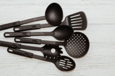 Kitchen tools plastic for multicooker on a wooden table