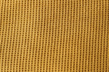 Kumaş kare örülmüş hardal rengi dokusu.