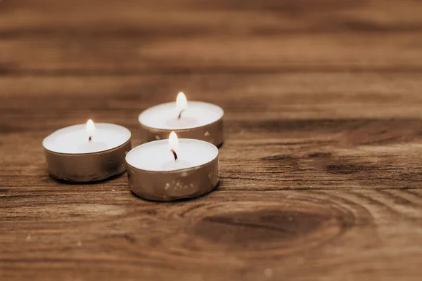 Three Paraffin Floating Candles Wooden Table — Stock Photo, Image