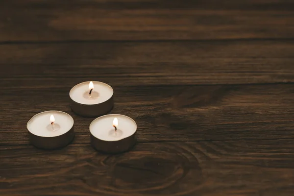Three Paraffin Floating Candles Wooden Table — Stock Photo, Image