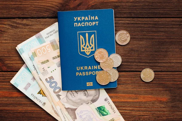 stock image Ukrainian hryvnia money and pills on the table and a Ukrainian passport..