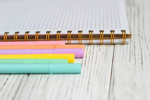 stock image Notebook diary for planning and studying on the table with colored markers.