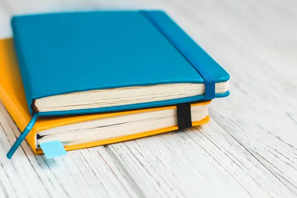 stock image Notebook diary for planning in blue and yellow.