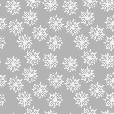 Gri bir zemin üzerinde kusursuz kar taneleri deseni