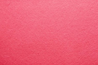 Parlak pembe desenli bir materyal, yaratıcı sanat projeleri veya zanaat faaliyetleri için ideal yumuşak bir kumaş yüzeyi sergiler.