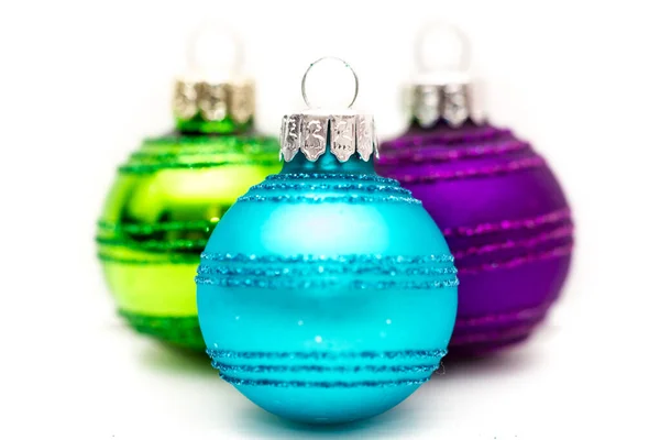 Three Colorful Christmas Baubles Turquoise Blue Purple Green White Focus — Stock Photo, Image