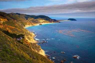 Coastal landscape of Cabrillo Highway in California with Point Sur in the background. clipart