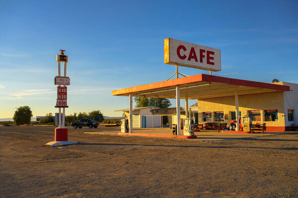 Amboy, California, USA - November 04, 2023 : Roys vintage cafe and gas station with neon sign in Amboy along historic Route 66 in Mojave Desert.