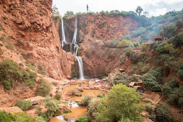 stock image The Ouzoud Waterfalls in Morocco, Africa. People can be seen around the base of the falls. Taken with a long exposure.