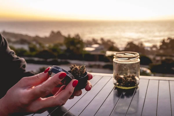 Hands Red Nails Putting Weed Bud Marijuana Grinder Glass Jar — Stock Photo, Image
