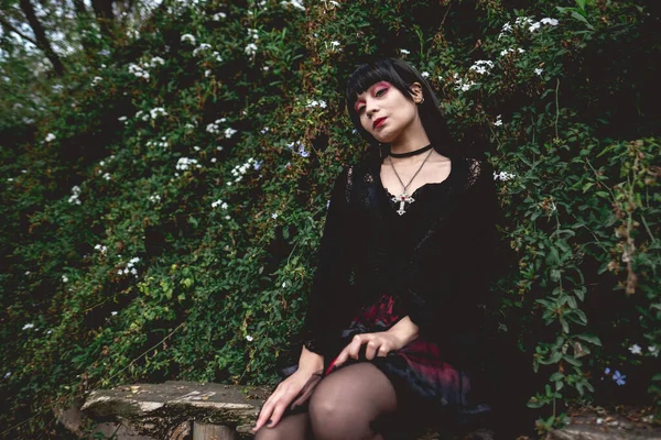 Young Skinny Hispanic Goth Girl Black Dress Red Skirt Seated — Stock Photo, Image