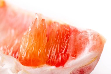 Pomelo on a white background. Pomelo advertising. Grapefruit. Pomelo pink. Fruit isolated. Cut pomelo on a white background. Pomelo macro shot. Grapefruit macro shot. Pomelo. Coppy juice on fruit. fruit macro shot