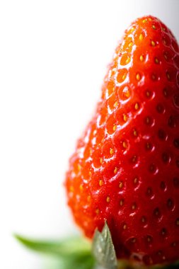 Strawberries on a white background. Isolated strawberry.Sliced berry.Sliced strawberries for garnish.Fresh, red and delicious strawberries isolated on white background.Delicious fresh red strawber