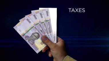 Angola Kwanza paper note holding. Fan of AOA banknotes in hand. Metaphor concept of income loss, cost of live, tax, credits and money decline.