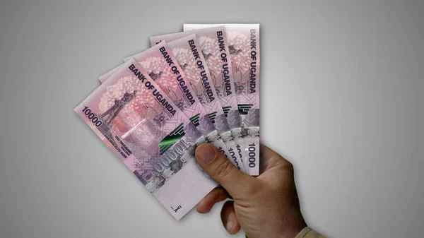 Uganda Scellino Mucchio Denaro Mano Illustrazione Banconote Ugx Concetto Fondo — Foto Stock