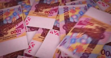 Batı Afrika CFA Frangı büyüyen para yığını. XOF banknotları dönüyor. Kusursuz ve döngülü finans kavramı, ekonomi krizi, enflasyon ve iş dünyası.