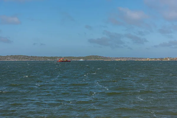 stock image Gothenburg, Sweden - May 07 2022: Service boat crossing a fjord on a windy spring day.