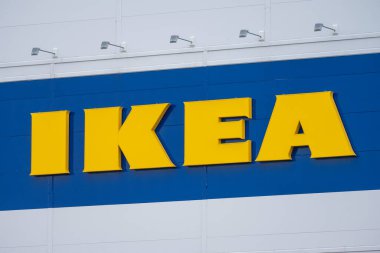 Gothenburg, Sweden - October 09 2022: Yellow IKEA sign on the exterior of a warehouse.
