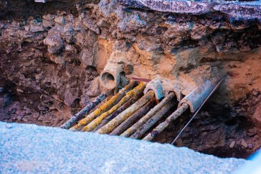 Old utilities pipes uncovered during road works.