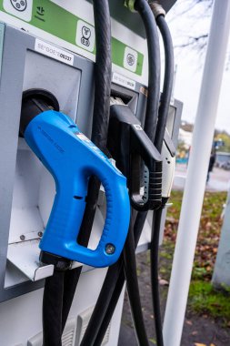 Gothenburg, Sweden - november 13 2022: CHAdeMO CCS and Type 2 cables at electric car charger at Linneplatsen.