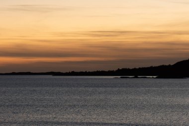 Golden sunset by the coast.