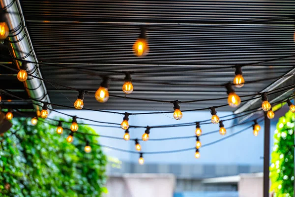 decorative light bulbs hanging from the roof.