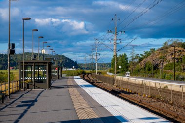 Kungsbacka, Sweden - september 11 2022: Railway station constructed at a track curve.