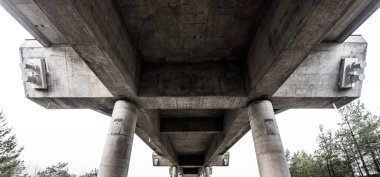 Underside of a tall suspension bridge.