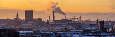 Gothenburg, Sweden - december 11 2022: Rooftop view over offices apartments and industry of Gothenburg on a ice cold afternoon.