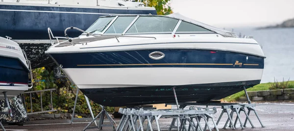 Kungsbacka, Sweden - October 23 2022: Yamarin boat laid up for the winter on a parking lot.