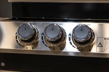 Regulators of a gas grill.